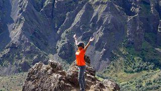 Nina Shah at the top of a mountain